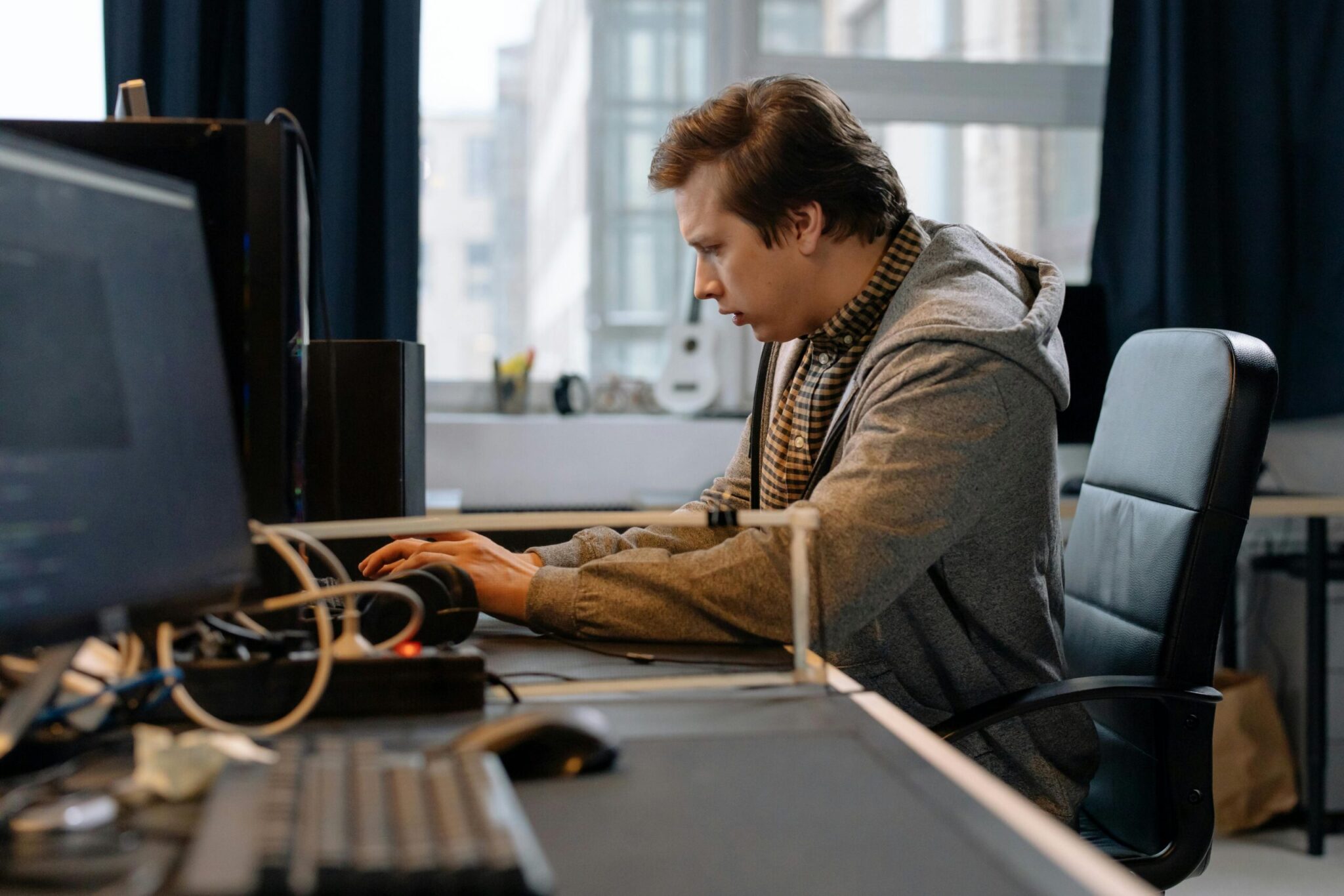 pexels-cottonbro-6803531-scaledjpg | ALCON DTS: Austin, TX Best Managed IT Support Services Free A concentrated professional working at a computer in a modern office setting. Stock Photo