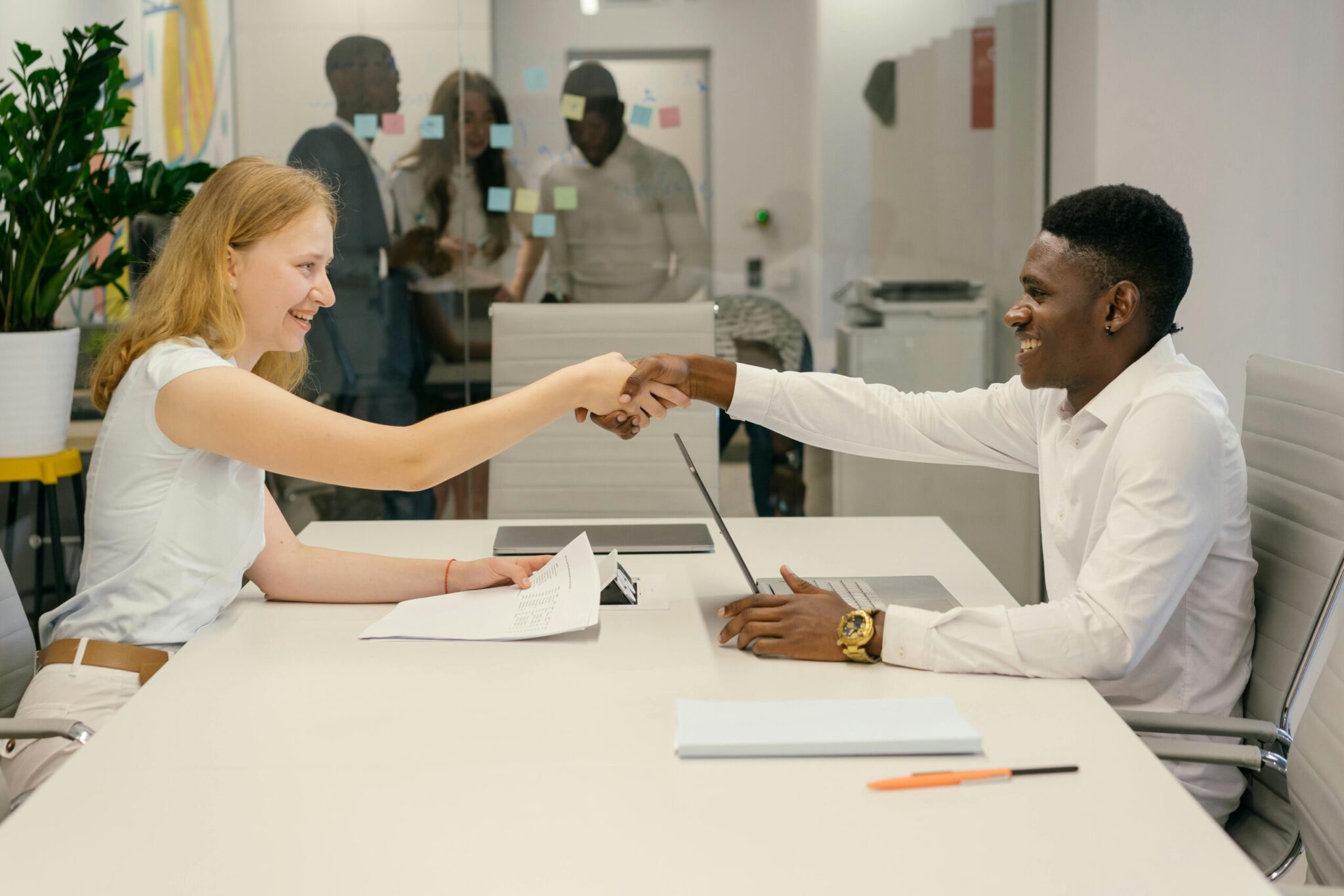 pexels-mikhail-nilov-9301879-scaledjpg | ALCON DTS: Austin, TX Best Managed IT Support Services Free Business professionals completing a successful deal with a handshake in a modern office setting. Stock Photo